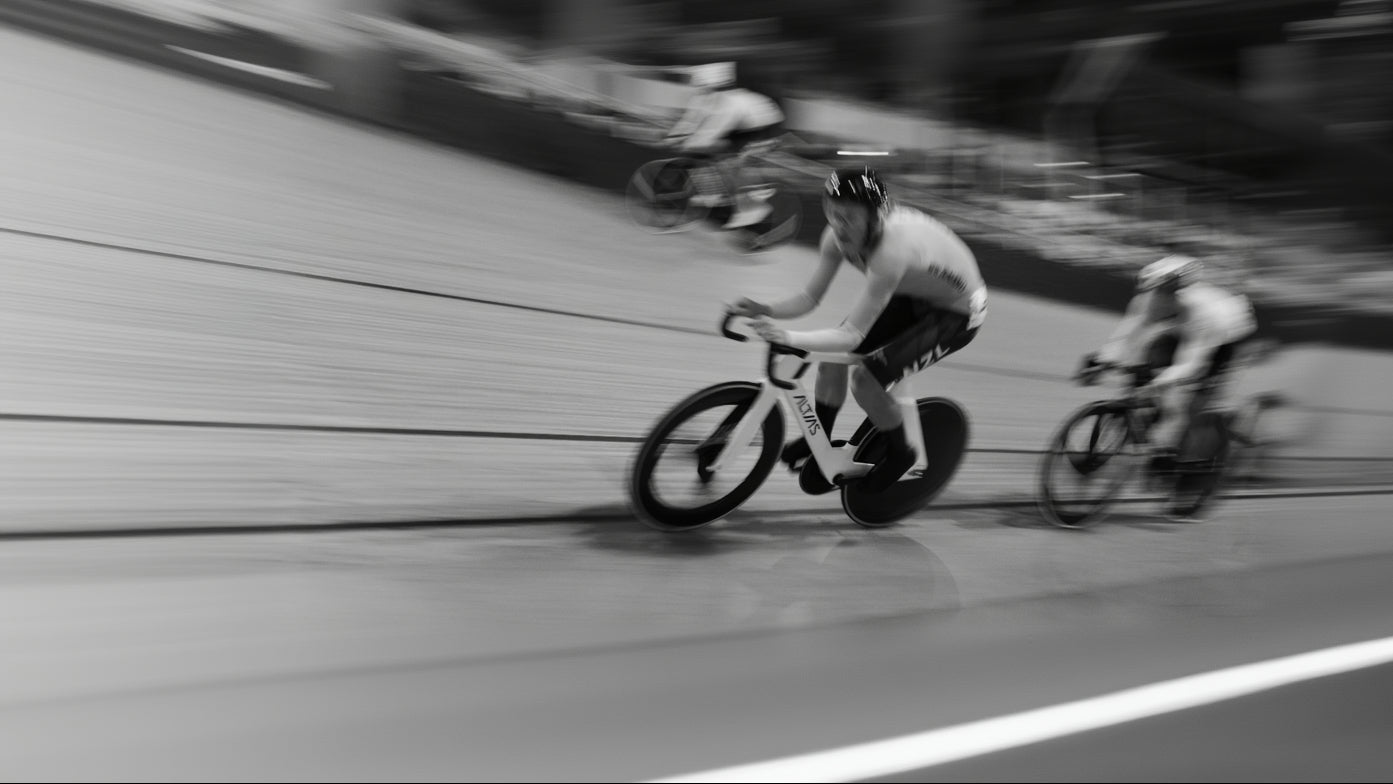 Bicycle race with cyclists on a track, black and white photo.