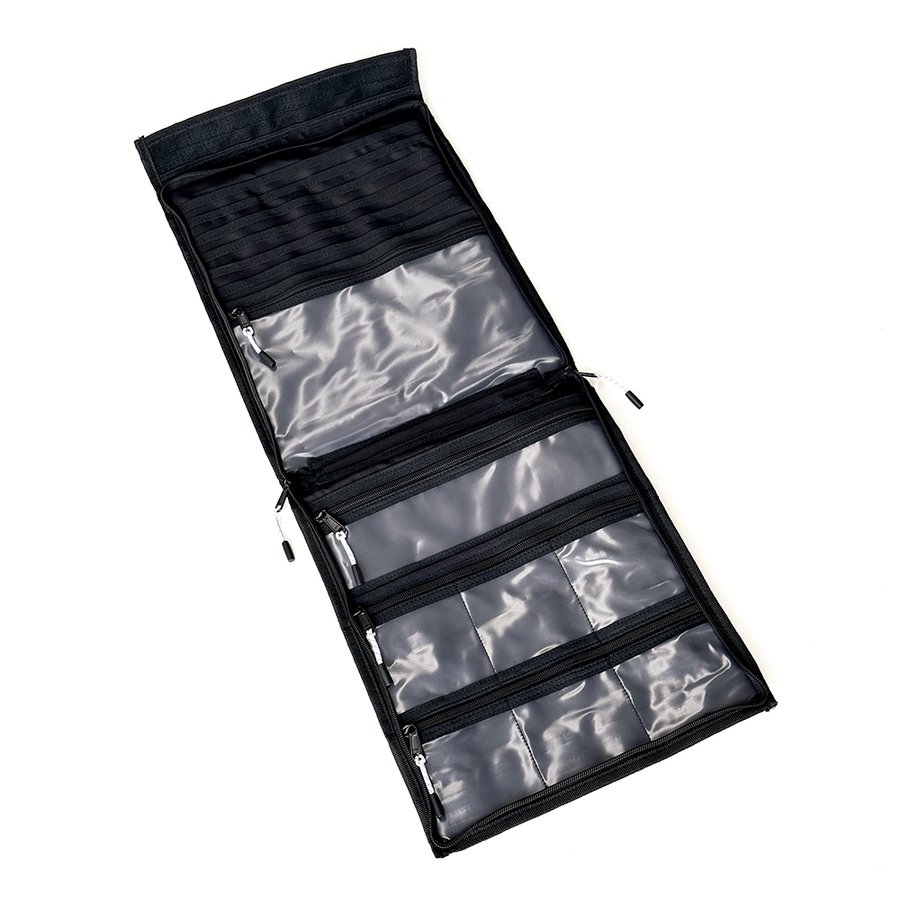 A black foldable track cycling chainring and cog organizer pouch shown open on a plain white background, featuring multiple zippered compartments and clear plastic pockets.